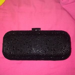 Black gemmed clutch bag